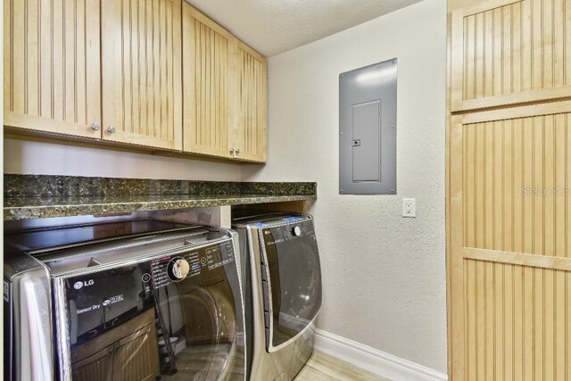 2825 Terra Ceia Bay Blvd Unit 1804, Palmetto, FL 34221 - laundry area featuring electric panel, washing machine and clothes dryer, cabinet space, and a textured wall