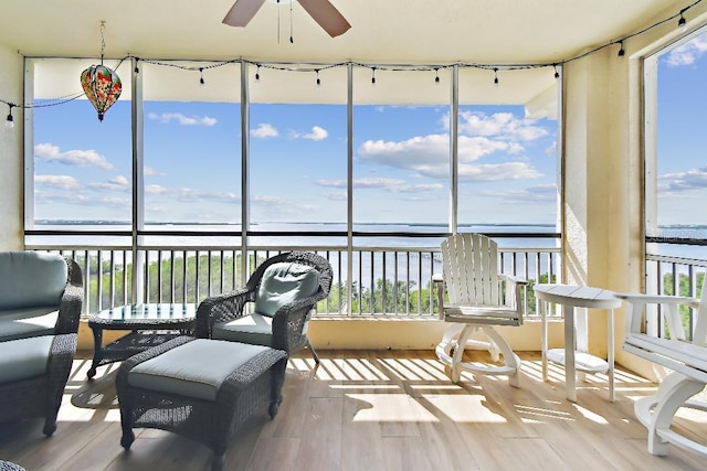 2825 Terra Ceia Bay Blvd Unit 1804, Palmetto, FL 34221 - sunroom featuring a water view and wood finished floors