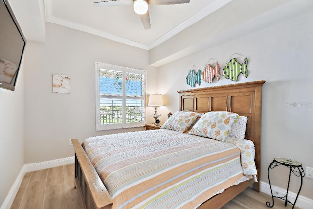 2825 Terra Ceia Bay Blvd Unit 1804, Palmetto, FL 34221 - bedroom with ornamental molding, light wood-style floors, and a ceiling fan