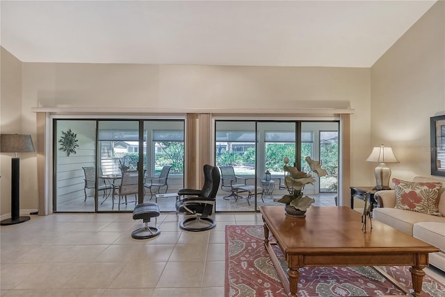 4555 Chandlers Forde Unit 47, Sarasota, FL 34235 - living area with healthy amount of natural light, tile patterned floors, and baseboards