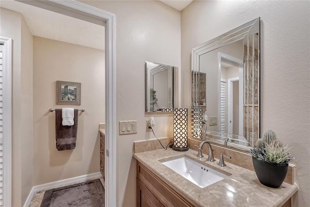 4555 Chandlers Forde Unit 47, Sarasota, FL 34235 - bathroom with vanity and baseboards