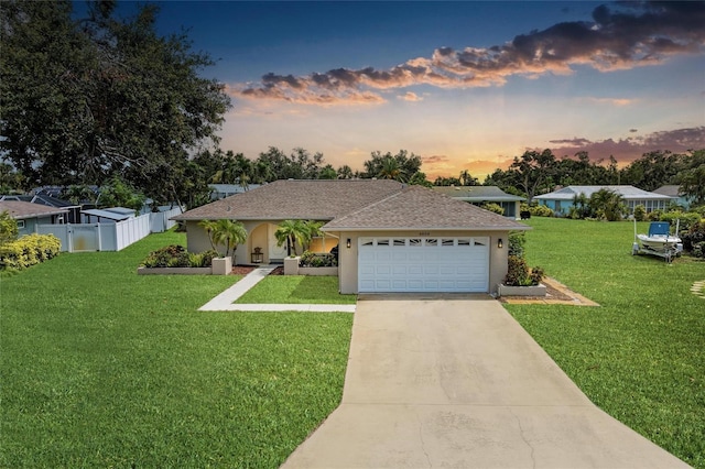 6804 19th Ave W, Bradenton, FL 34209 - ranch-style home with an attached garage, driveway, and stucco siding