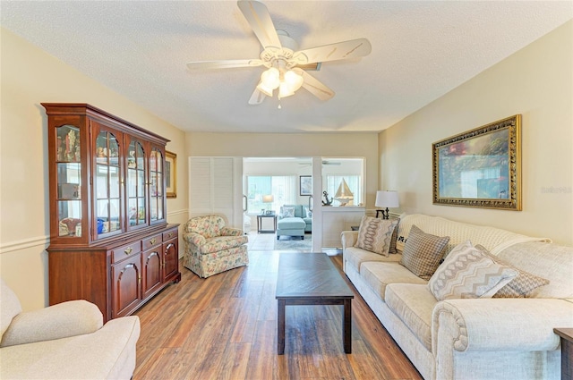 6804 19th Ave W, Bradenton, FL 34209 - living area featuring a ceiling fan, wood finished floors, and a textured ceiling