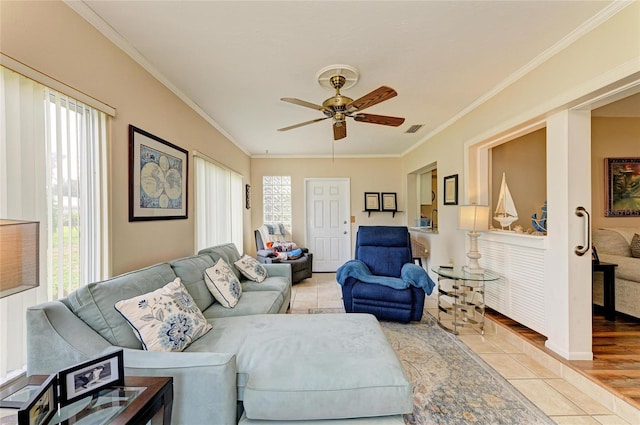 6804 19th Ave W, Bradenton, FL 34209 - living area with crown molding, ceiling fan, and light tile patterned floors