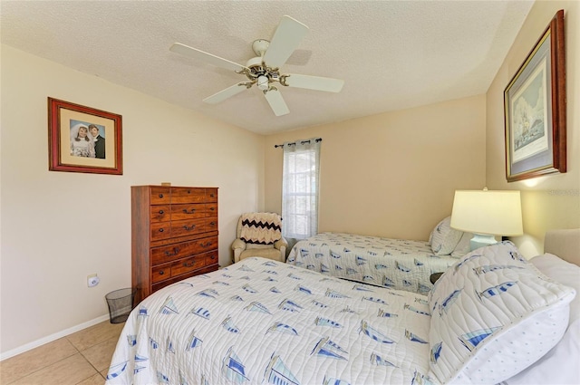 6804 19th Ave W, Bradenton, FL 34209 - bedroom featuring light tile patterned flooring, a ceiling fan, and a textured ceiling