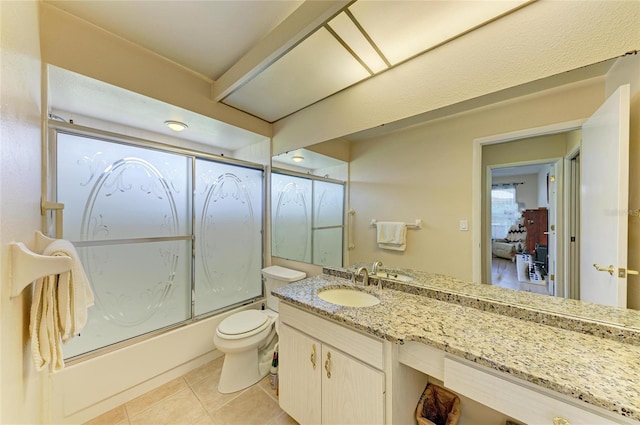 6804 19th Ave W, Bradenton, FL 34209 - bathroom with bath / shower combo with glass door, vanity, and tile patterned floors