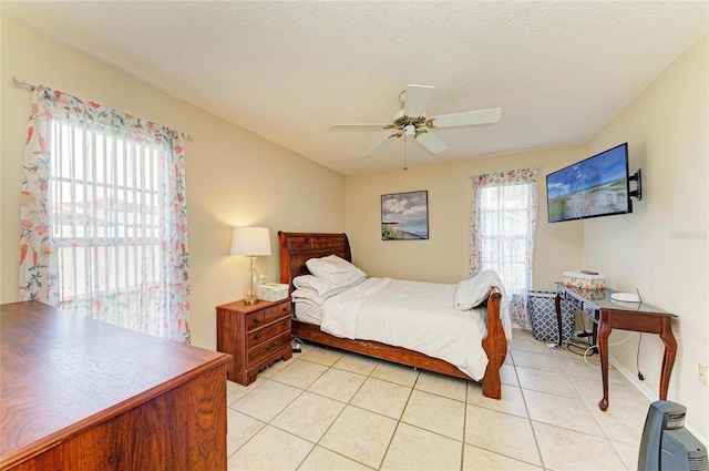 6804 19th Ave W, Bradenton, FL 34209 - bedroom with light tile patterned flooring and a ceiling fan