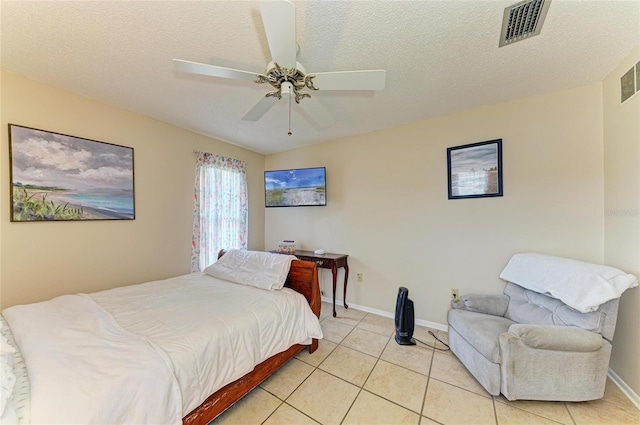 6804 19th Ave W, Bradenton, FL 34209 - bedroom featuring light tile patterned floors, a textured ceiling, and a ceiling fan