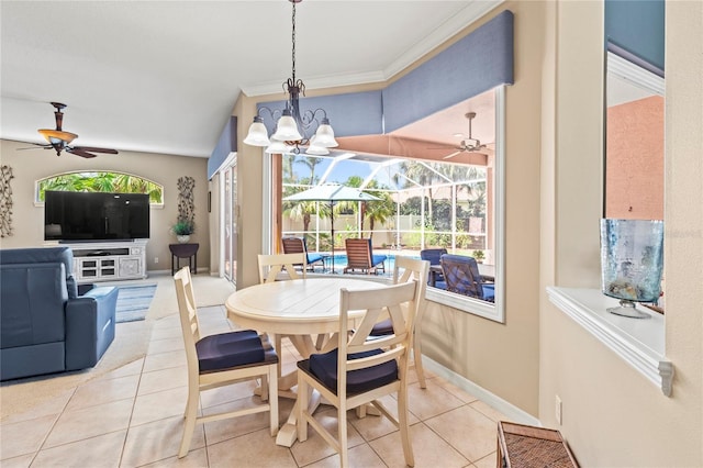 866 Oak Briar Ln, Osprey, FL 34229 - tiled dining space with a ceiling fan, a chandelier, and baseboards