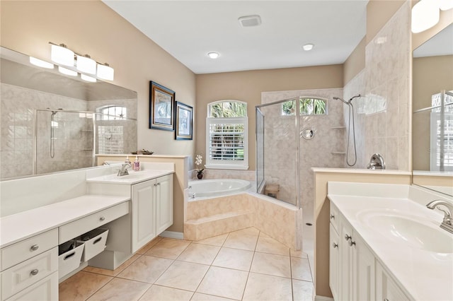 866 Oak Briar Ln, Osprey, FL 34229 - bathroom featuring a tile shower, two vanities, a bath, and tile patterned flooring