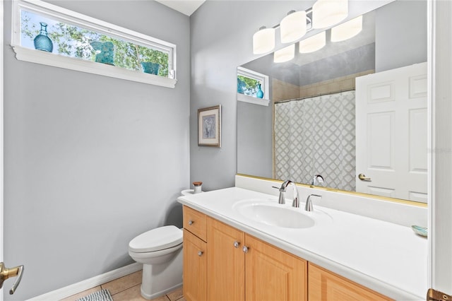 866 Oak Briar Ln, Osprey, FL 34229 - full bathroom with toilet, vanity, tile patterned floors, a shower with shower curtain, and baseboards