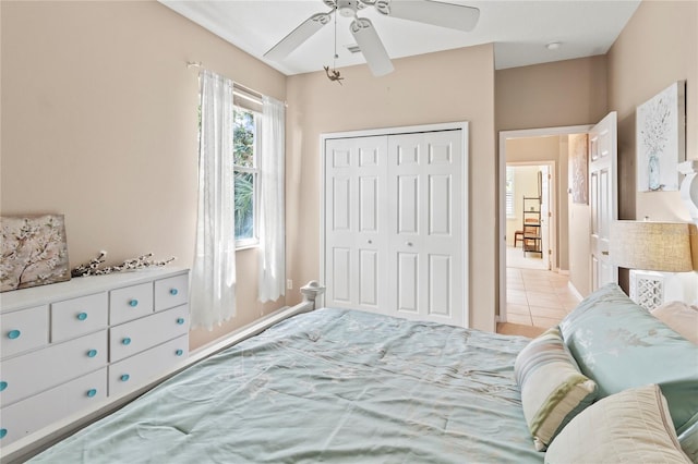 866 Oak Briar Ln, Osprey, FL 34229 - bedroom featuring a closet, a ceiling fan, and tile patterned flooring