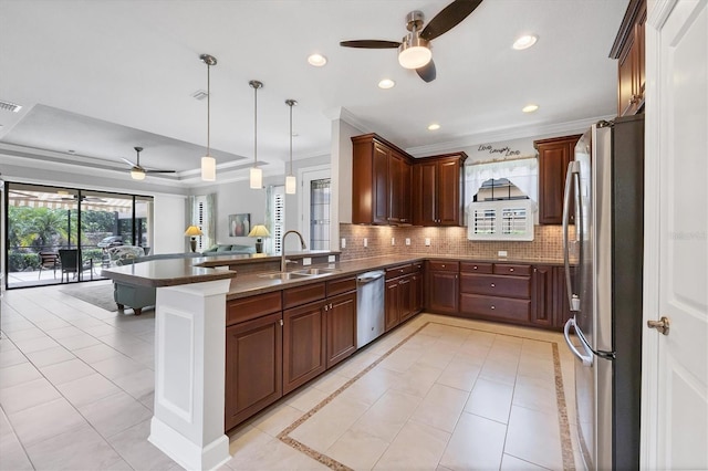 5117 Serata Dr, Bradenton, FL 34211 - kitchen featuring a ceiling fan, stainless steel appliances, a sink, ornamental molding, and open floor plan