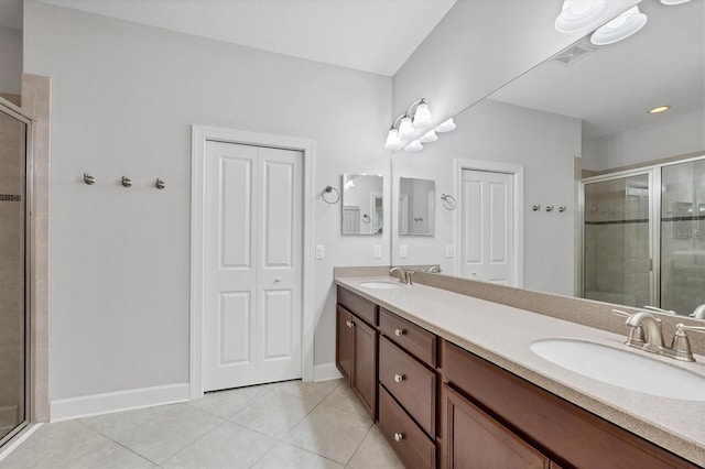 5117 Serata Dr, Bradenton, FL 34211 - bathroom featuring tile patterned floors, double vanity, and a stall shower