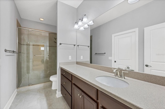 5117 Serata Dr, Bradenton, FL 34211 - full bathroom featuring vanity, toilet, a shower stall, tile patterned flooring, and baseboards