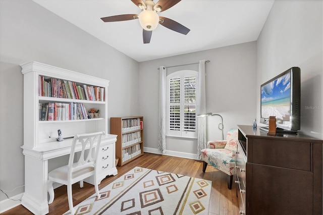 5117 Serata Dr, Bradenton, FL 34211 - office area with wood finished floors, ceiling fan, and baseboards