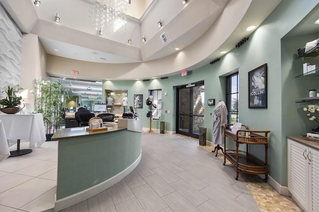 5117 Serata Dr, Bradenton, FL 34211 - reception area featuring a chandelier, recessed lighting, and a high ceiling