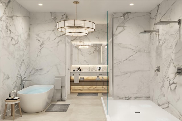 290 Cocoanut Ave Unit 8B, Sarasota, FL 34236 - bathroom with stone wall, a marble finish shower, recessed lighting, vanity, and a freestanding tub