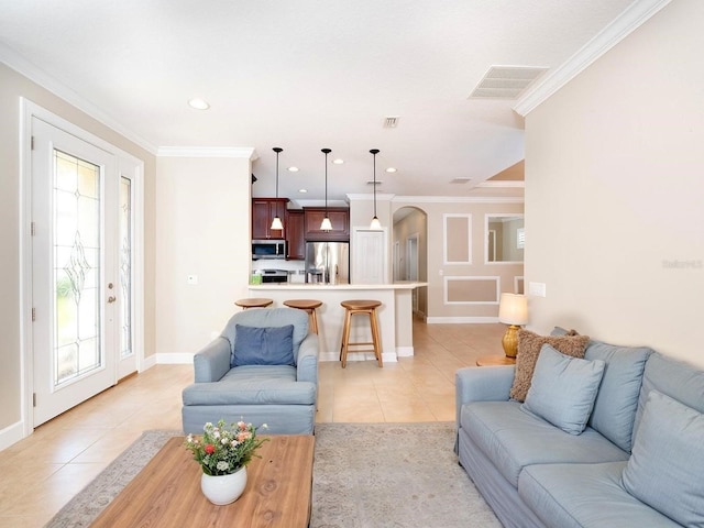 4949 Savona Run, Bradenton, FL 34211 - living area featuring light tile patterned flooring, arched walkways, recessed lighting, and ornamental molding