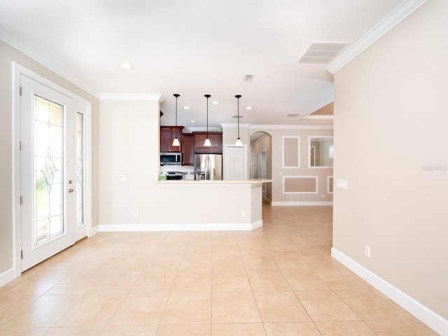 4949 Savona Run, Bradenton, FL 34211 - kitchen with stainless steel appliances, arched walkways, a peninsula, ornamental molding, and recessed lighting