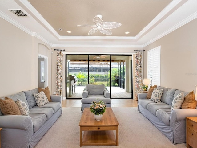 4949 Savona Run, Bradenton, FL 34211 - living room featuring a tray ceiling, ceiling fan, crown molding, and light tile patterned floors