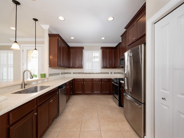 4949 Savona Run, Bradenton, FL 34211 - kitchen featuring appliances with stainless steel finishes, light countertops, ornamental molding, light tile patterned flooring, and recessed lighting