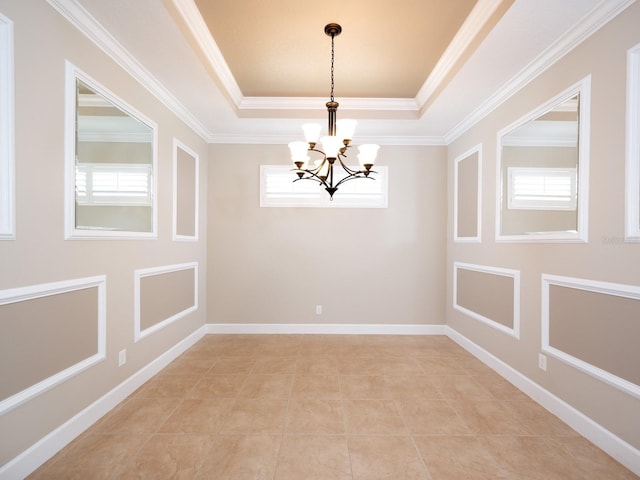 4949 Savona Run, Bradenton, FL 34211 - empty room featuring a tray ceiling, a chandelier, crown molding, and light tile patterned floors