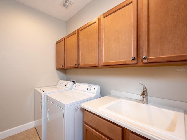 4949 Savona Run, Bradenton, FL 34211 - washroom featuring cabinet space, washer and dryer, and light tile patterned floors