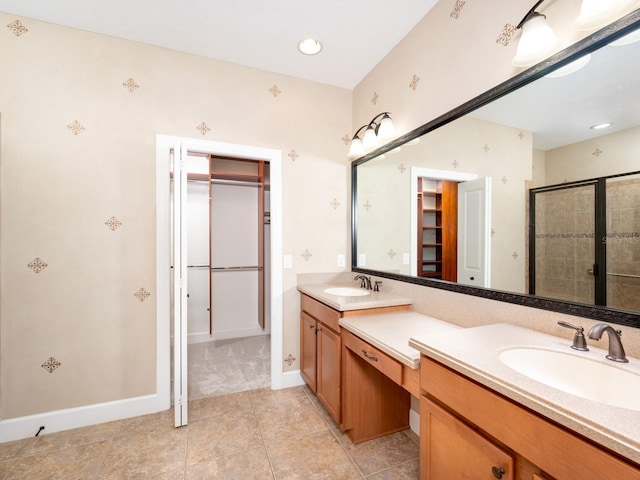 4949 Savona Run, Bradenton, FL 34211 - bathroom featuring a spacious closet, double vanity, a stall shower, tile patterned flooring, and recessed lighting