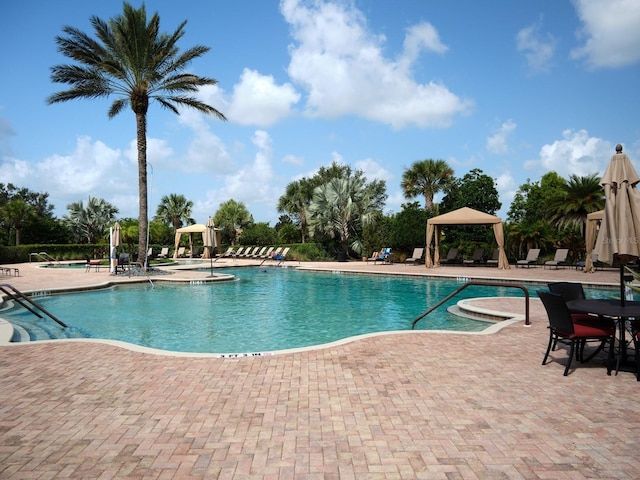 4949 Savona Run, Bradenton, FL 34211 - community pool featuring a gazebo and a patio