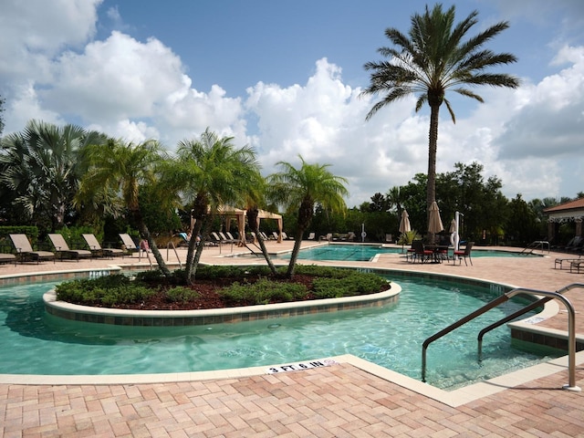 4949 Savona Run, Bradenton, FL 34211 - community pool featuring a patio