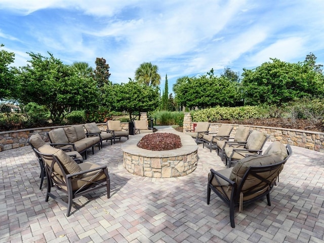 4949 Savona Run, Bradenton, FL 34211 - view of patio featuring an outdoor living space with a fire pit