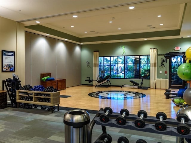 4949 Savona Run, Bradenton, FL 34211 - exercise room featuring crown molding, a tray ceiling, recessed lighting, and wood finished floors