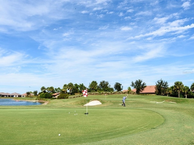 4949 Savona Run, Bradenton, FL 34211 - surrounding community featuring view of golf course, a water view, an area to practice putting, and a yard