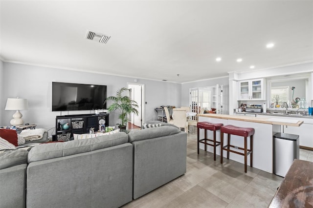 2204 67th St W, Bradenton, FL 34209 - living room featuring ornamental molding and recessed lighting