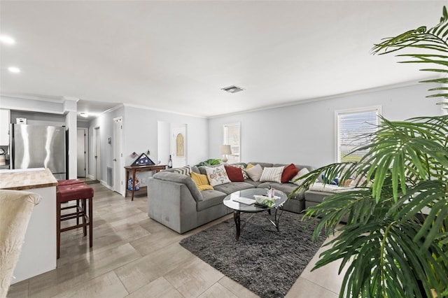 2204 67th St W, Bradenton, FL 34209 - living room featuring healthy amount of natural light, crown molding, and recessed lighting