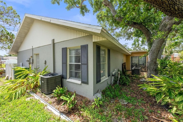 2204 67th St W, Bradenton, FL 34209 - view of side of property featuring central AC and stucco siding
