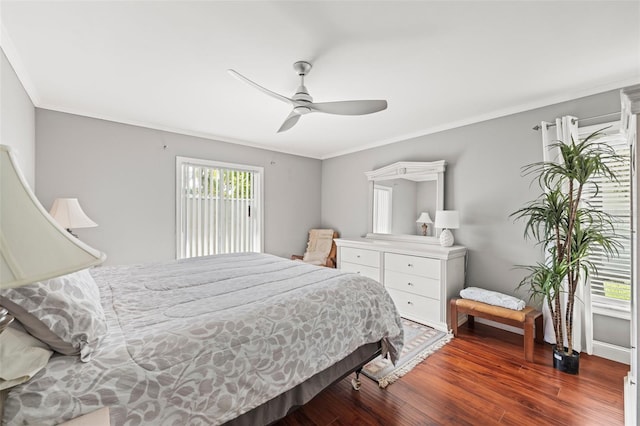 2204 67th St W, Bradenton, FL 34209 - bedroom with multiple windows, wood finished floors, a ceiling fan, ornamental molding, and baseboards