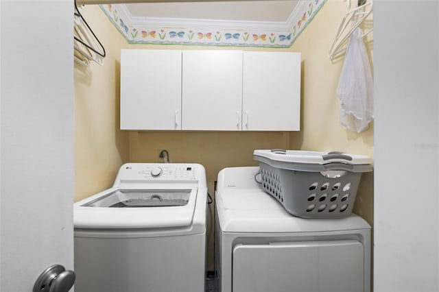 2204 67th St W, Bradenton, FL 34209 - laundry area featuring cabinet space, washing machine and dryer, and crown molding