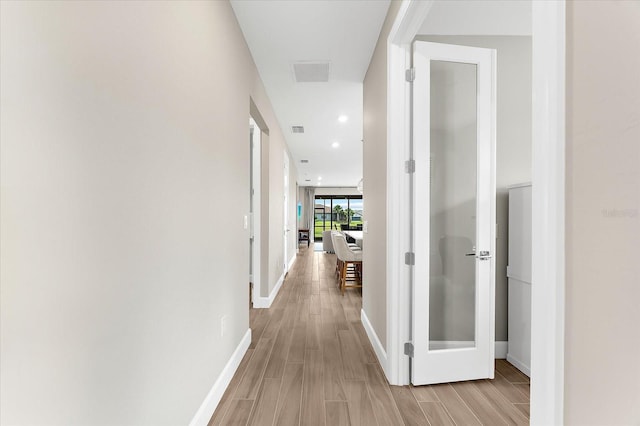 6791 Alstead Cir, Bradenton, FL 34202 - corridor featuring light wood finished floors and recessed lighting
