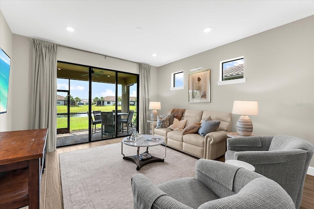 6791 Alstead Cir, Bradenton, FL 34202 - living room featuring a water view, wood finished floors, and recessed lighting