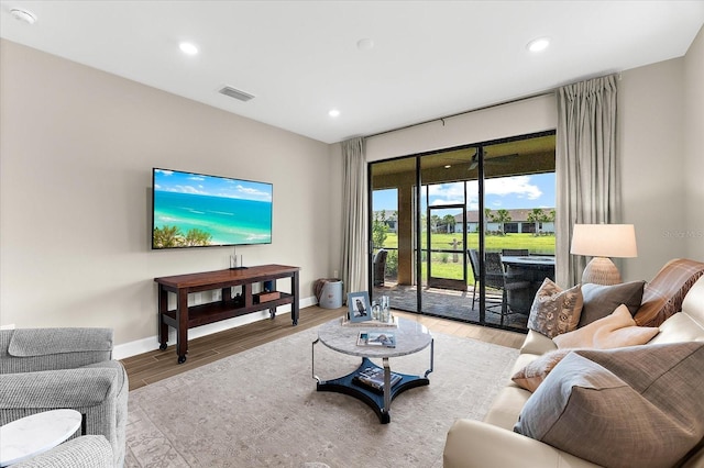6791 Alstead Cir, Bradenton, FL 34202 - living room featuring light wood-style flooring and recessed lighting