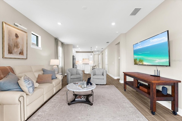 6791 Alstead Cir, Bradenton, FL 34202 - living area with wood tiled floors and recessed lighting