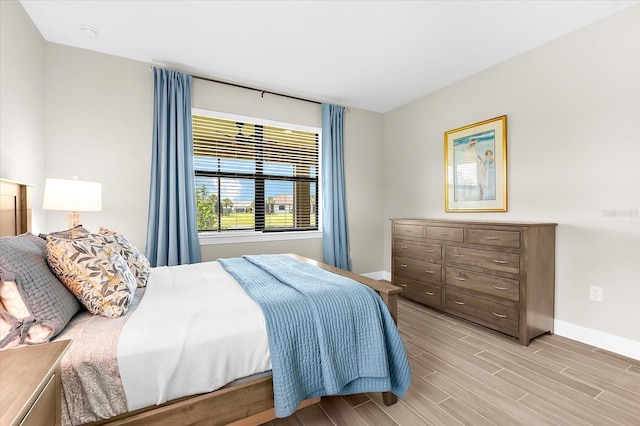6791 Alstead Cir, Bradenton, FL 34202 - bedroom featuring baseboards and light wood-type flooring