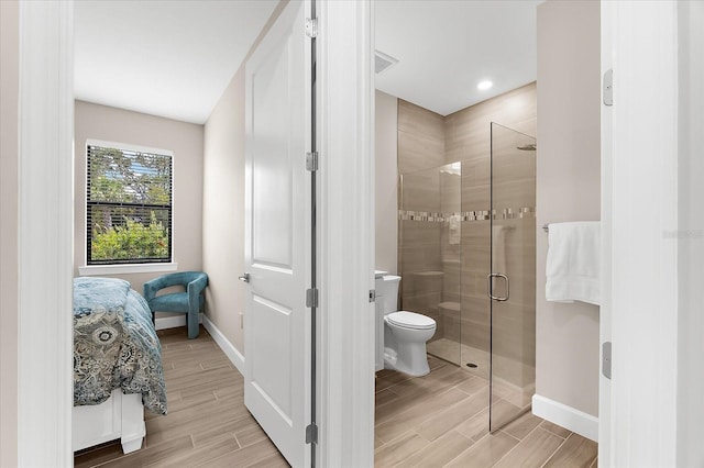 6791 Alstead Cir, Bradenton, FL 34202 - bathroom featuring a stall shower and wood tiled floors