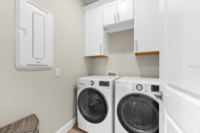 6791 Alstead Cir, Bradenton, FL 34202 - laundry room with washing machine and clothes dryer and cabinet space