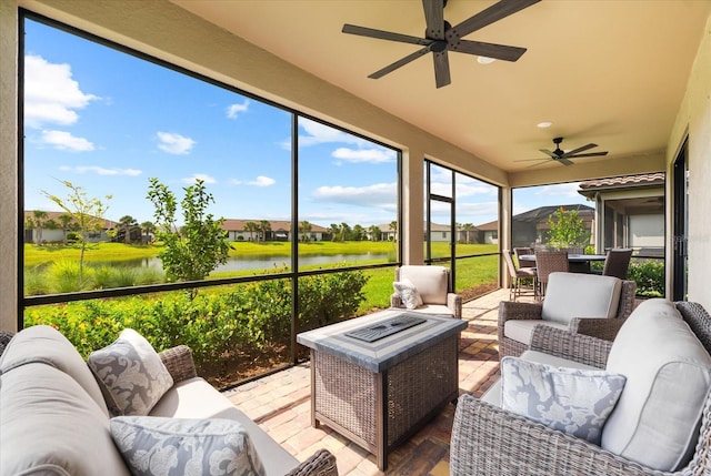 6791 Alstead Cir, Bradenton, FL 34202 - sunroom featuring ceiling fan, a water view, and an outdoor living space