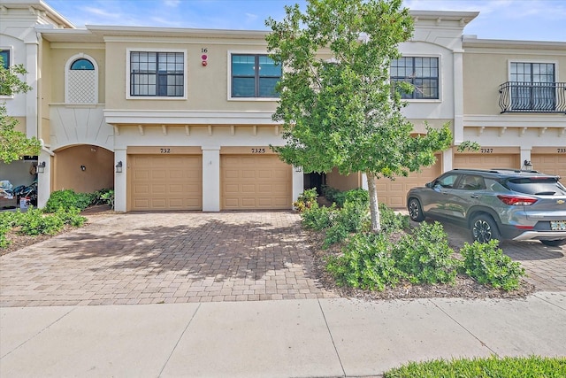 7325 Skybird Rd Unit 399, Bradenton, FL 34209 - view of property featuring driveway, an attached garage, and stucco siding