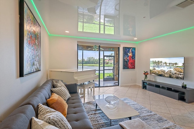 7325 Skybird Rd Unit 399, Bradenton, FL 34209 - living room featuring light tile patterned flooring, a towering ceiling, baseboards, and recessed lighting