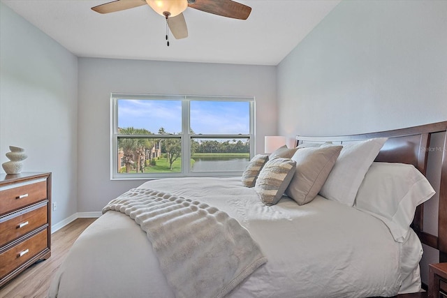 7325 Skybird Rd Unit 399, Bradenton, FL 34209 - bedroom with light wood-style flooring, baseboards, and a ceiling fan